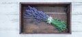 Close up of bouguet of violet purple lavendula lavender flowers herbs with wooden pendant with the word: