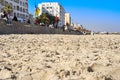 Close-up of Boujaafar sandy beach overlooking the promenade and hotels on the Corniche