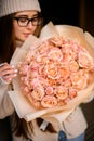 Close-up of a bouquet of beige roses in a beige wrapper Royalty Free Stock Photo