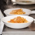 Close-up of a bowl of bolognese pasta.