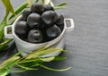 Close up of bowl filled with freshly harvested black olives Royalty Free Stock Photo