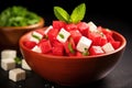 close-up of a bowl filled with juicy watermelon cubes and feta cheese Royalty Free Stock Photo