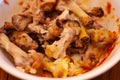 Close up of a bowl full of chicken bones from home made chicken wings after eating