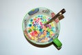 Close up of a bowl full of fruit flavored loops of sugar ready to eat breakfast cereal with a spoon sticking out Royalty Free Stock Photo