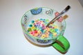 Close up of a bowl full of fruit flavored loops of sugar ready to eat breakfast cereal with a spoon sticking out Royalty Free Stock Photo