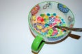 Close up of a bowl full of fruit flavored loops of sugar ready to eat breakfast cereal with a spoon sticking out Royalty Free Stock Photo