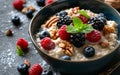 Close-up of a bowl of oatmeal with berries and nuts.
