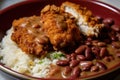 Close-up of a bowl of red beans and rice topped with crispy fried chicken and drizzled with honey mustard sauce Royalty Free Stock Photo