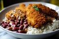 Close-up of a bowl of red beans and rice topped with crispy fried chicken and drizzled with honey mustard sauce Royalty Free Stock Photo