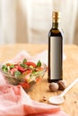 Close-up of a bowl of summer salad and a mock-up bottle of nut butter on the table. Royalty Free Stock Photo