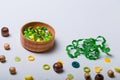 Box of beads and buttons, tape or ribbon for sewing and embroidery. Green and yellow set of materials for handcraft Royalty Free Stock Photo