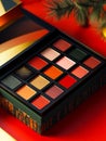 A close up of a box of makeup on a red background Royalty Free Stock Photo