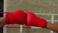 Close-up of boxing gloves hitting together, symbolizing sportsmanship in ring