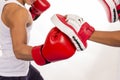 Close up of boxing workout action in fitness class on white back