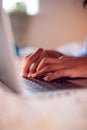 Close Up Of Boy In Bedroom Typing On Keyboard Of Laptop Royalty Free Stock Photo