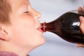Close Up Of Boy Drinking Soda From Bottle Royalty Free Stock Photo