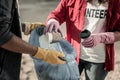 Close up of boy and girl participating in voluntary cleaning action on the beach Royalty Free Stock Photo