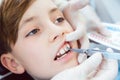 Close-up of a boy during inspection of oral cavity