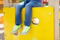 Close up of boy legs on children playground Royalty Free Stock Photo