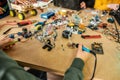 Perfect practice makes perfect sense. Close up of a boy making robot, using soldering iron to join chips and wires