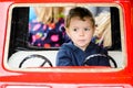 Close Up of a Boy on a Merry-Go-Round Car #2 Royalty Free Stock Photo