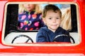 Close Up of a Boy on a Merry-Go-Round Car Royalty Free Stock Photo