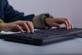 Close-up of boy playing on computer