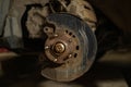 Close-up of a brake disc and pad on a car. Repairing and changing brakes on a car in a garage. A man repairs the brakes Royalty Free Stock Photo