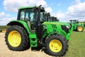Close up of brand new John Deere cab tractor at head of row