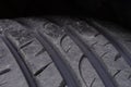 Close up of brand new tire tread installed on the vehicle. Royalty Free Stock Photo