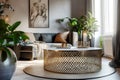 Close up of brass metal mesh round coffee table near black sofa against window. Bohemian style home interior design of modern