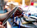 Close-up brazing process - tools in hands in jewelry workshop