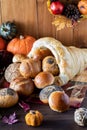 Close up of a bread cornucopia overflowing with rolls.