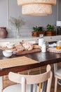 Close-up of bread, milk and food mat on a table in a kitchen interior on a countryside Royalty Free Stock Photo