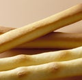 Close up of breadsticks on beige background created using generative ai technology