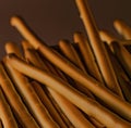 Close up of breadsticks on black background created using generative ai technology