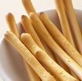 Close up of breadsticks in bowl on white background created using generative ai technology