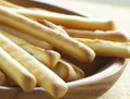 Close up of breadsticks on wooden background created using generative ai technology
