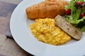 Close up breakfast set (Scrambled egg, croissant and vietnamese