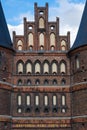 Close up of the brick-built Holsten Tor old city gate of LÃÂ¼beck reading the golden letters concordia domi foris pax