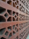 close up of brick red ventilation bloks contemporary architecture design, persfektive