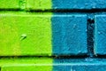 Close up The brick wall is painted in half green and turquoise in color. background Royalty Free Stock Photo