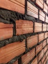Close-Up of a Brick Wall Under Construction Highlighting Textured Surface and Fresh Mortar for a Robust Visual Appeal Royalty Free Stock Photo