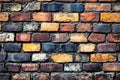 A brick wall with many different colored bricks on it Royalty Free Stock Photo