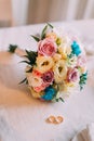 Close-up of bridal bouquet with pair golden wedding rings Royalty Free Stock Photo