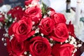 Close up of bridal bouquet of red roses on table Royalty Free Stock Photo