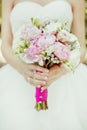 Close-up bridal bouquet of spring pink and white flowers on a blurred background, selective focus Royalty Free Stock Photo