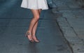 Close-up of a bride dancing in the street. Body part. Woman with bright dress dancing in the street of Valletta. Legs. Woman`s leg