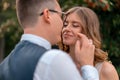 Close up Of Bride Face And Groom Hand Touching Her Face With Tender. Wife Looking AT Husband With Love and Adoration