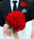 Close up bride and groom, bouquet and boutonniere.